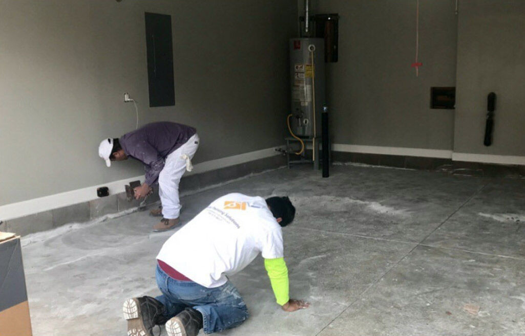 Stellar Painting crew prepping a garage floor